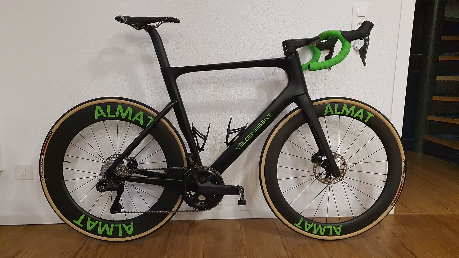 Custom-designed Vélobsessive road bike in company branding