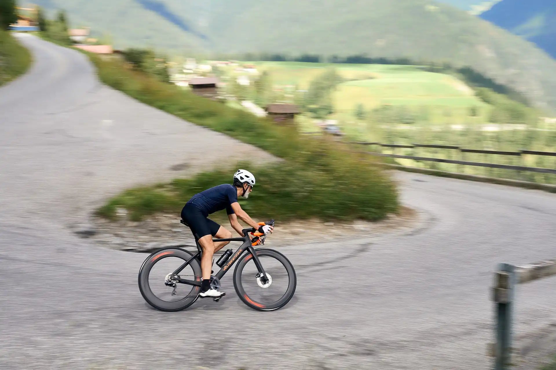Road cyclist on a Vélobsessive bike in the mountains
